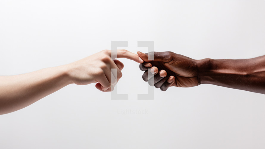 The hand of a dark-skinned African man holding on to the finger of a white Caucasian man. 