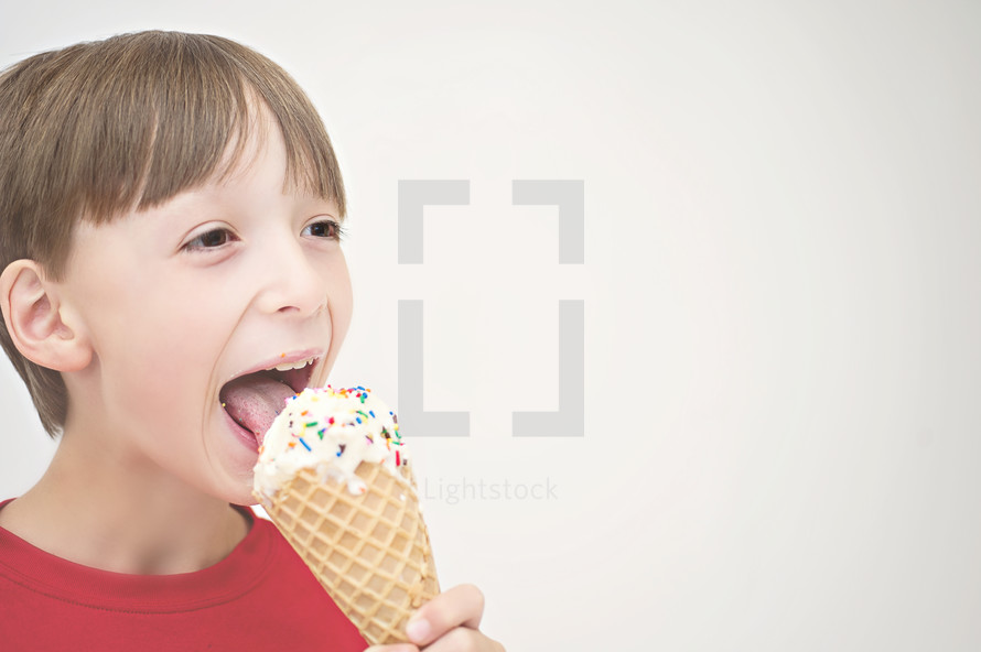 boy child licking a ice cream cone