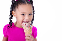 girl child eating an ice cream cone 