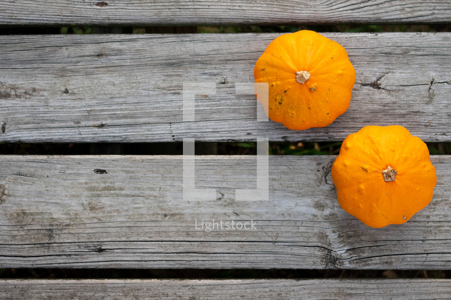 orange pumpkins on a deck 