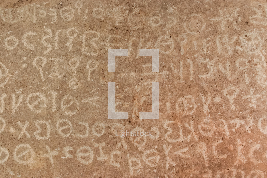 Ancient writing on stone displayed at Mt Nebo, where Moses died