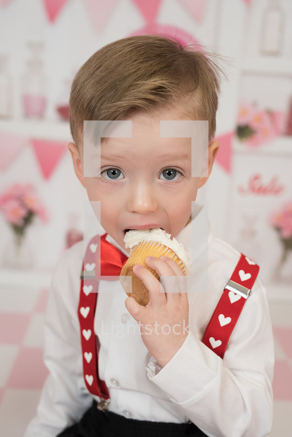 a child eating a cupcake 