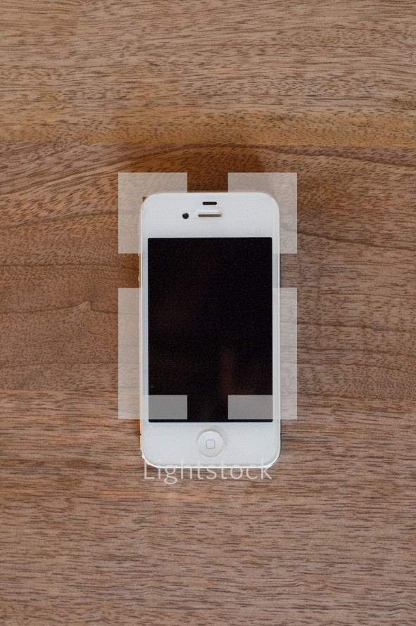 cellphone on a wood floor 
