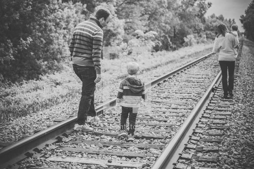 family on train tracks 