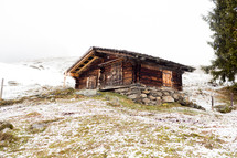 a log cabin on a mountaintop 