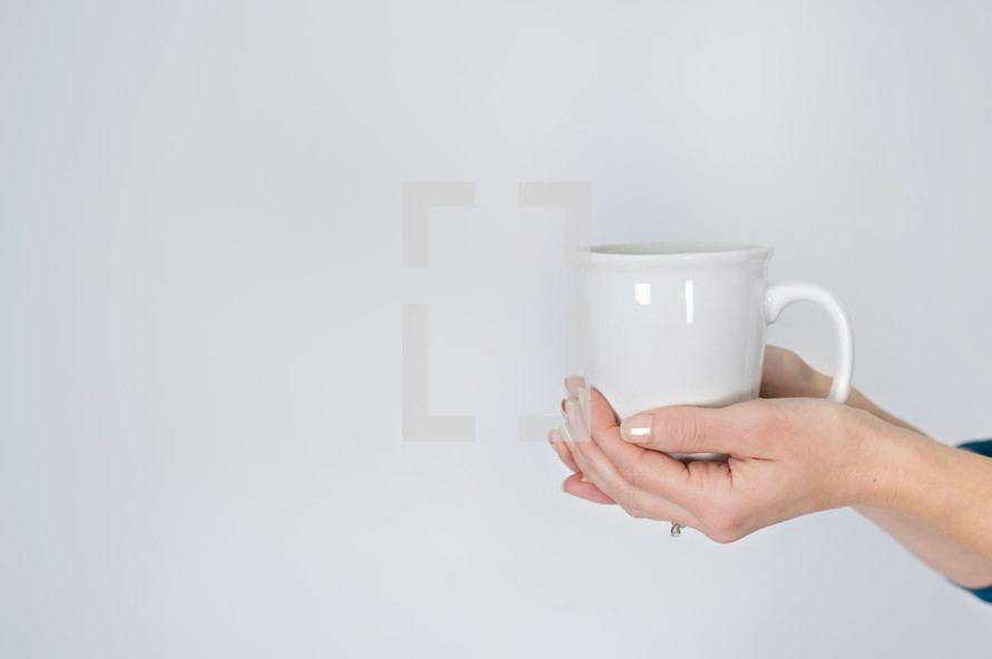 woman holding a mug of coffee