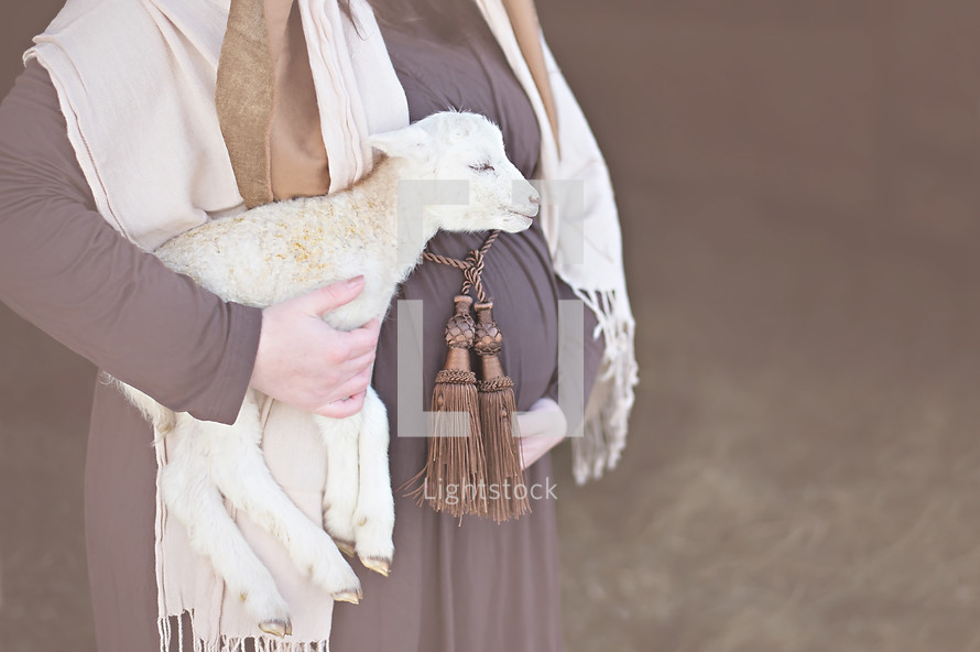 pregnant Mary holding a lamb 