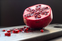 pomegranate on a cutting board 