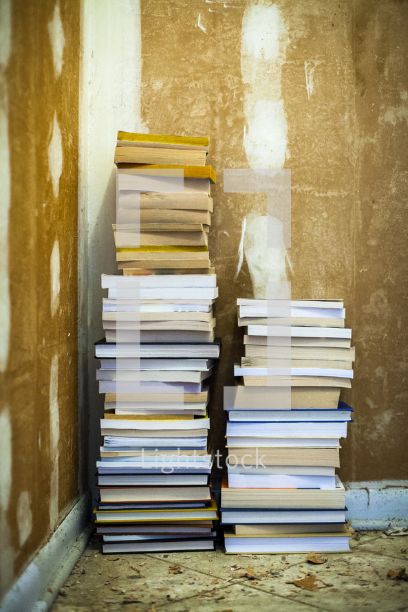 stacks of books in a corner 