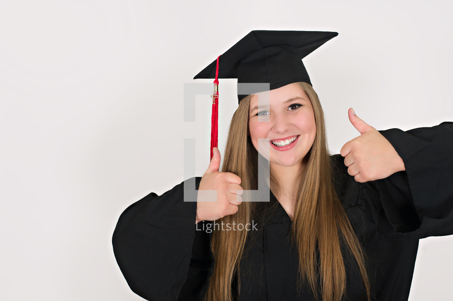 graduates with thumbs up 