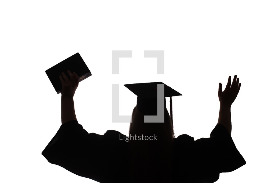 female graduate with raised hands 