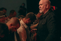 praying during a worship service 