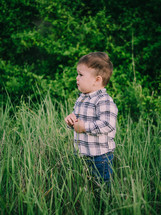 toddler boy in a field 