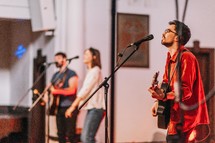worship leaders singing and playing worship music 