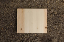 wood board on dirt