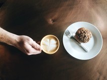 cappuccino and muffin on a plate 