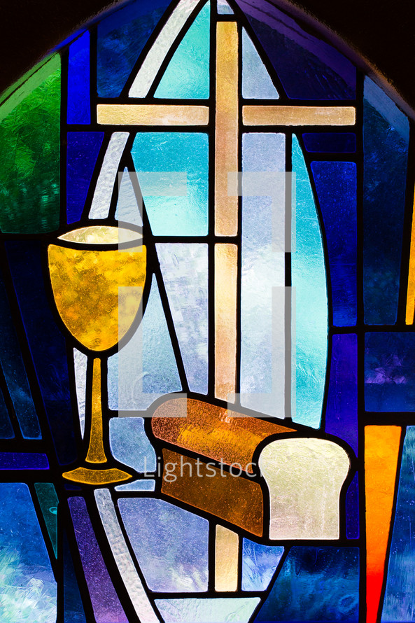 stained glass window depicting communion 