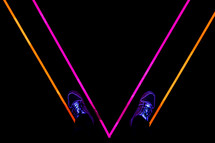 shoes on a glowing neon light floor 