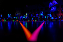 youth group glow stick neon lights at night party 