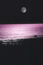 full moon over purple sea 
