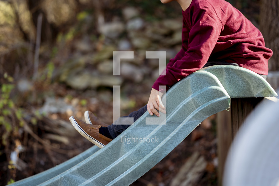a boy on a slide 