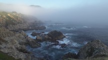Misty Coastline of Carmel By The Sea and Big Sur - a Rugged Stretch of California Central Coast known for Winding Roads and Seaside Cliffs