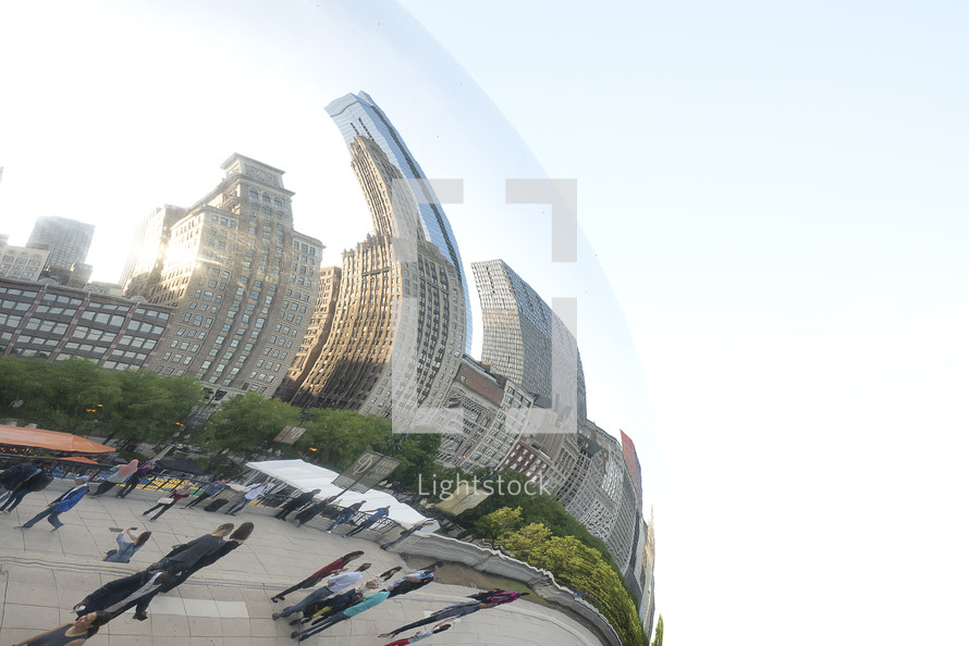 curved reflection of a city in a round object 