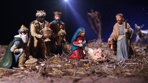 Nativity scene with figurines of the Infant Jesus, His mother Mary, Joseph, shepherds and the Magi.