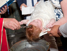 Christian baptism, the priest wetting child head.