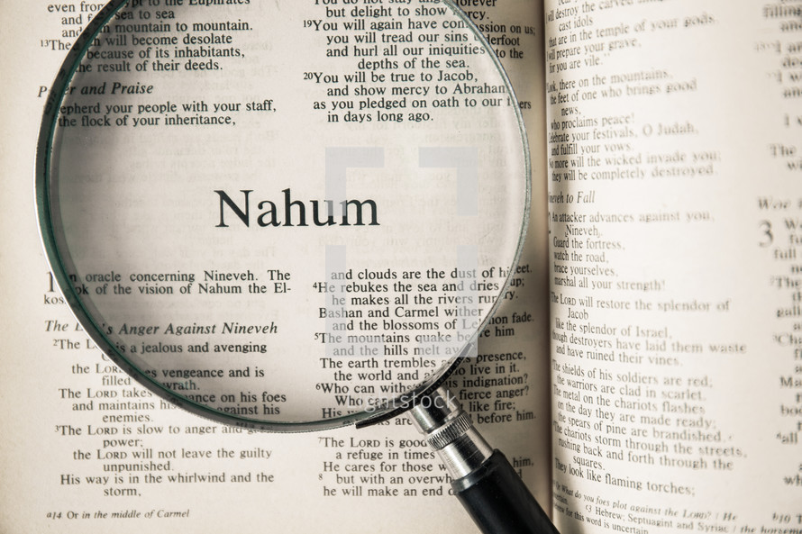 magnifying glass over Bible - Nahum 