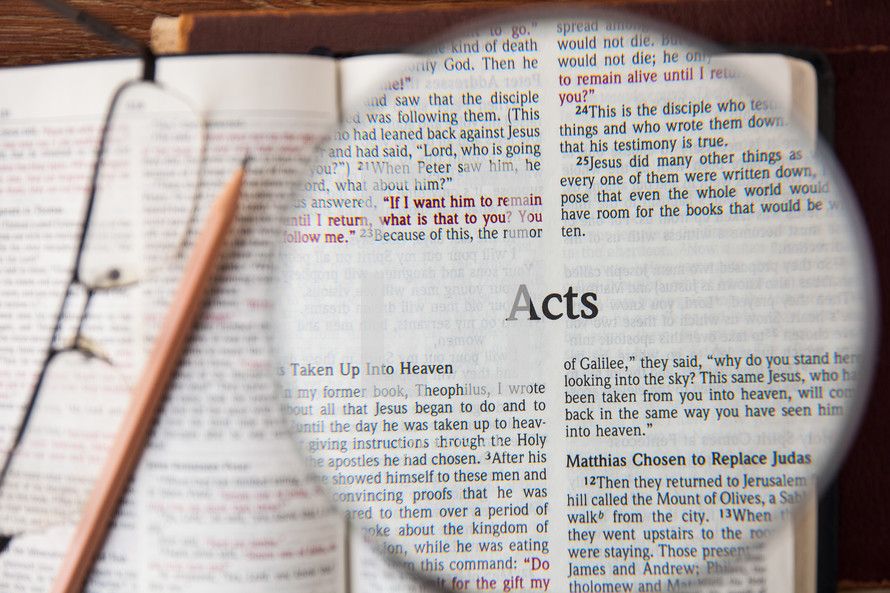 magnifying glass over Acts