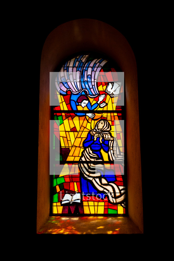 Stained glass window. The announcement by the archangel Gabriel to Mary.