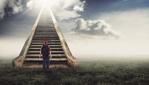 man walking up a stairway to Heaven
