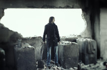 a man standing in an abandoned building 
