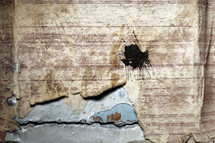 peeling wallpaper on rusty metal 