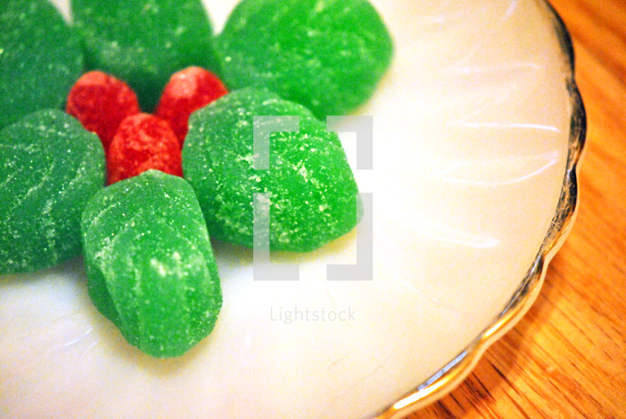 Gumdrop candy shaped like holly leaves and berries.