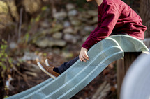 a boy on a slide 