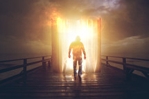 a man entering a glowing Bible on a pier 