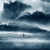 man standing scratching his head in front of a giant wave and wall of water 
