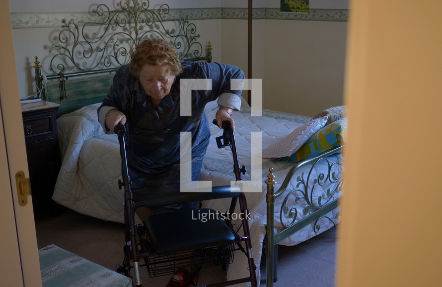 elderly woman using a walker 