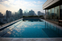 Luxurious rooftop infinity pool overlooking a bustling cityscape at dusk