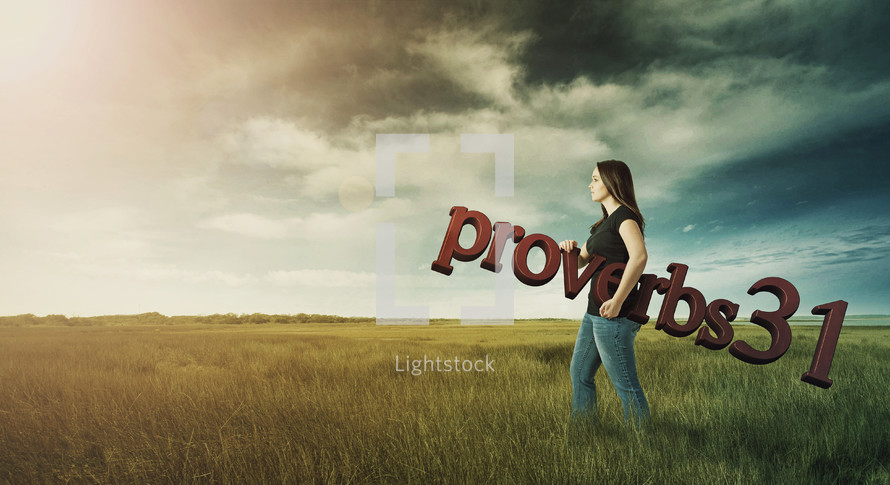 Woman carrying Proverbs 31 through a field on a stormy day.