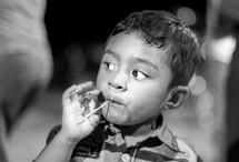 child with a toothpick 