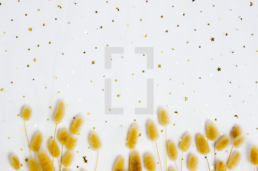 gold confetti and gold fuzzy grasses 
