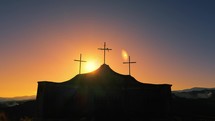 Silhouette of crucifixes at sunset 