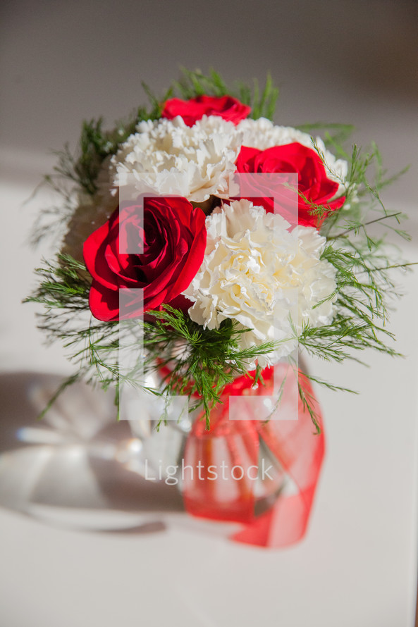 roses and carnations in a vase 
