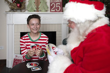 a boy and Santa playing Uno 