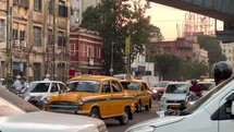 Busy streets and people in Kolkata, India.