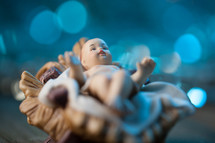 figurine of baby Jesus in a manger 