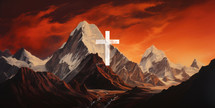 Cross against red and orange sky over snow covered mountain peak at sunset